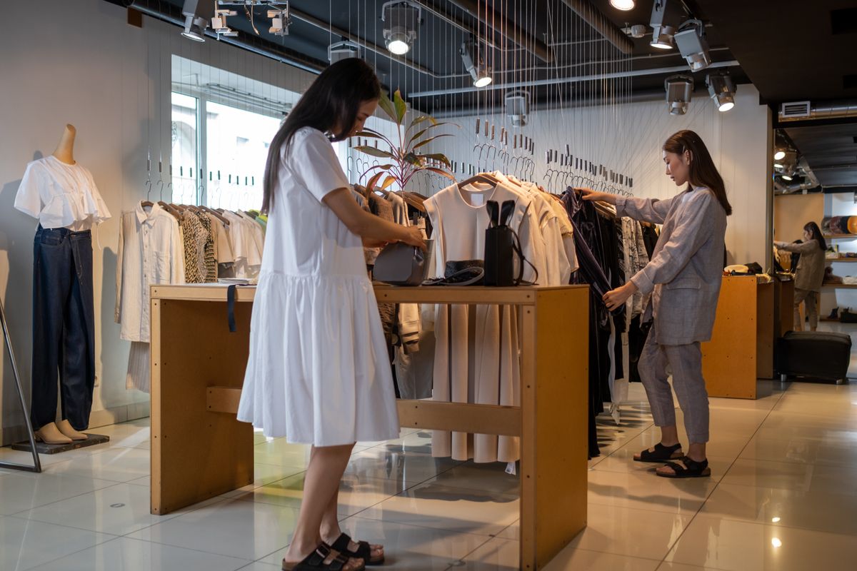 Modern fashion retail store interior lit by bright adjustable display lighting