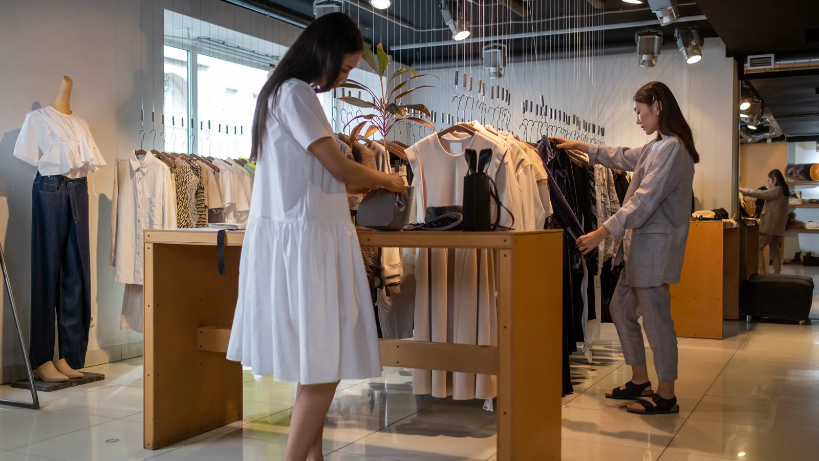 Modern fashion retail store with LED track lighting achieving 500 to 1000 lux on featured merchandise displays