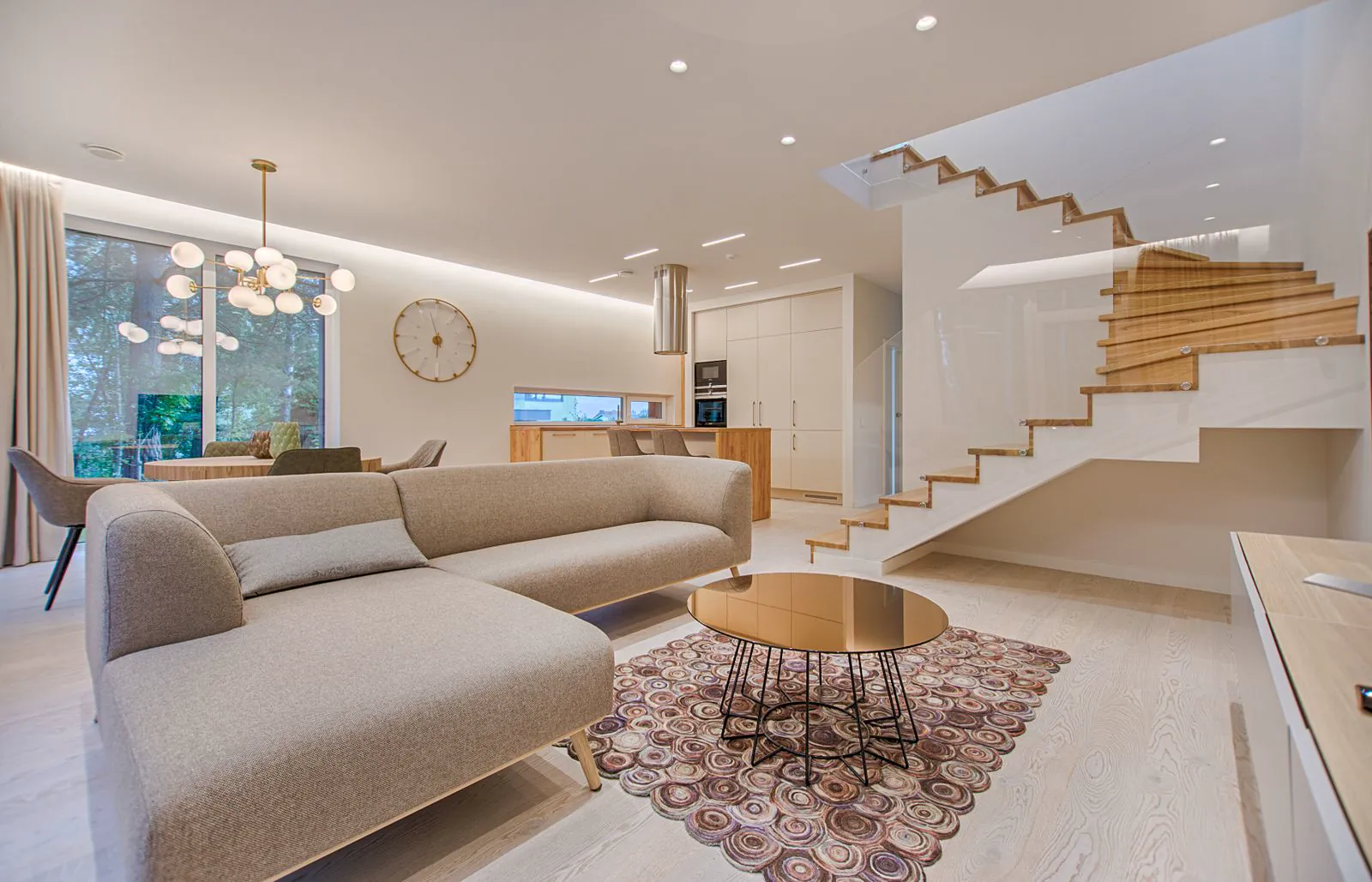 Modern residential interior with sleek sofa and ETL certified LED track lighting providing warm illumination