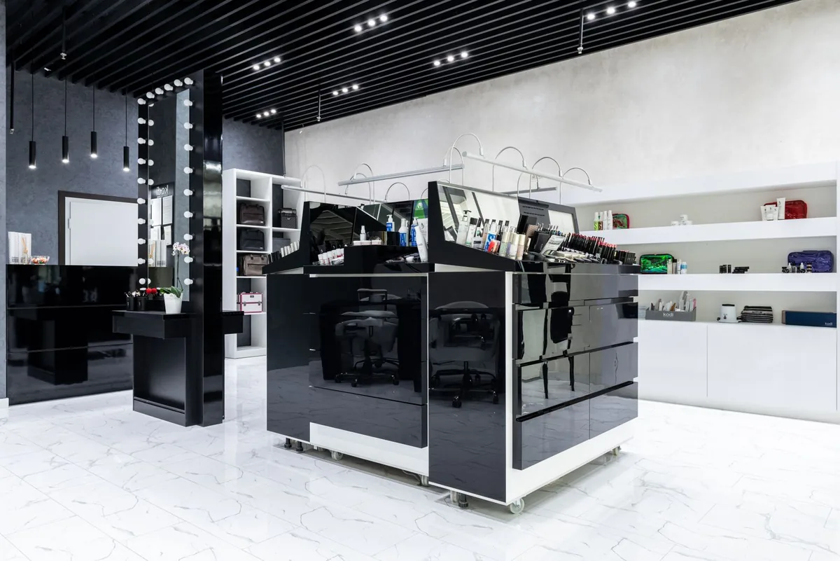 Modern cosmetics store with illuminated display units showing how neutral high CRI retail display lighting supports foundation colour matching